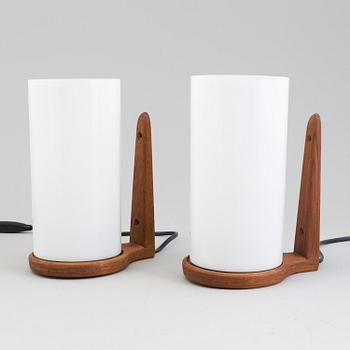 A pair of Uno och Östen Kristiansson teak wall lights from Luxus, Vittsjö, 1960s.