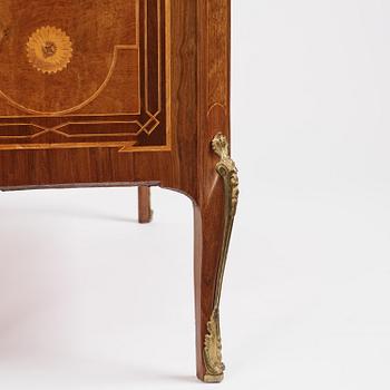 A Gustavian marquetry, ormolu-mounted and limestone-top commode by Georg Haupt (master in Stockholm 1770-84).