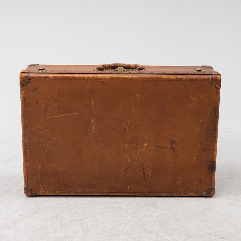 Louis Vuitton, a leather suitcase, first half of the 20th Century.