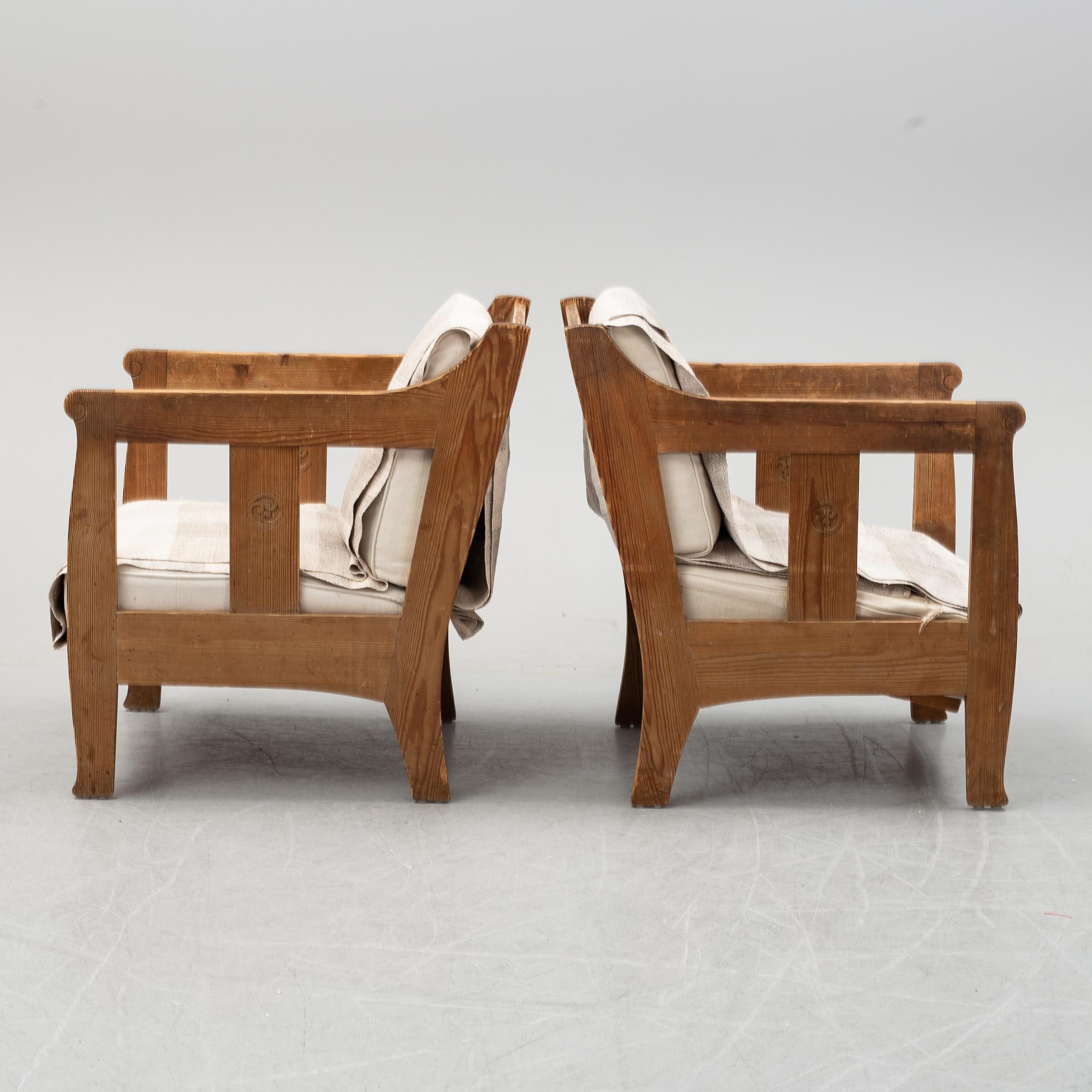 A pair of pine armchairs attributed to Carl Westman, early 20th Century.
