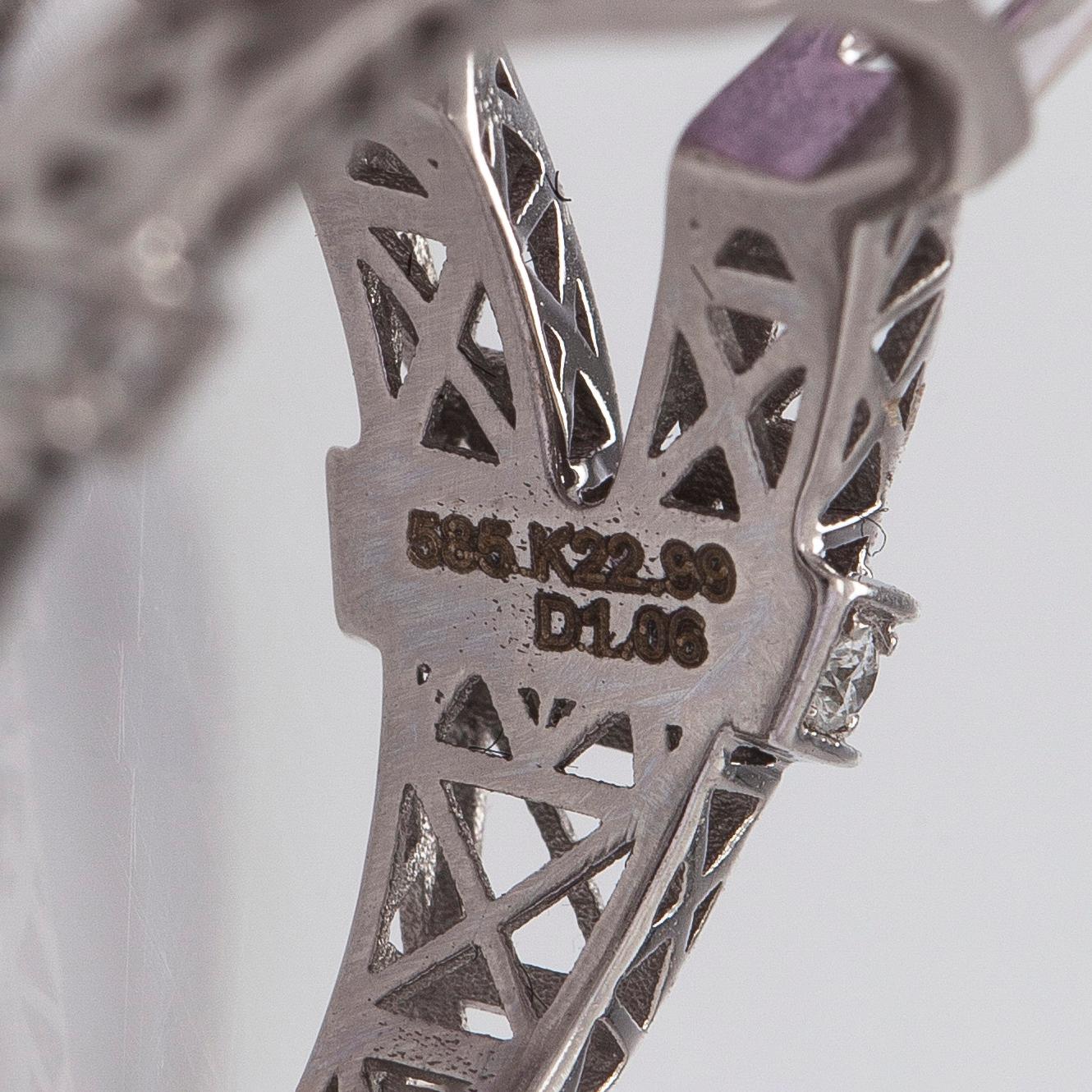 A 14K gold ring with kunzite and diamonds.