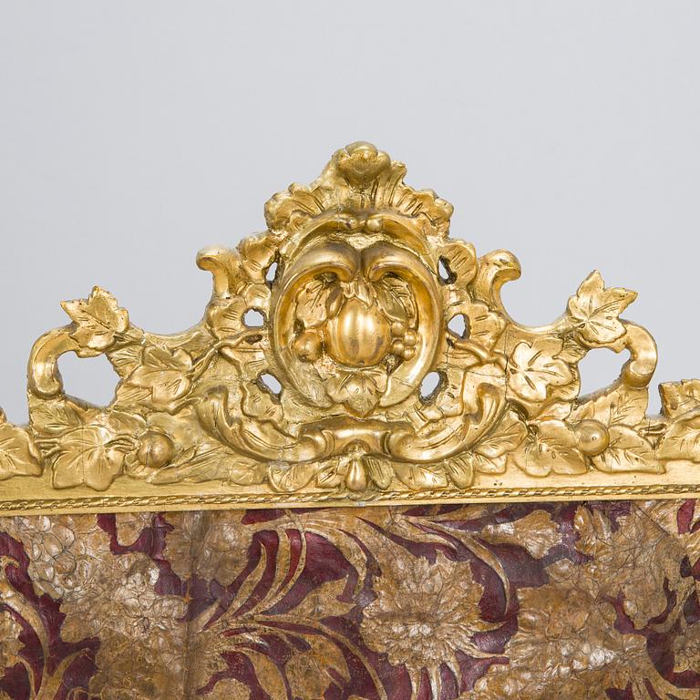 A Baroque style/Rococo revival brass protection, late 19th century.