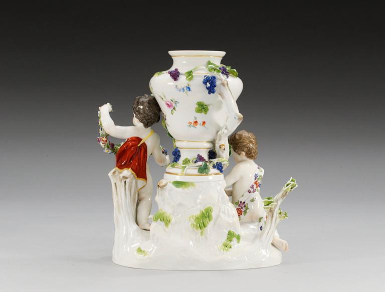 A Meissen figure group with a vase, 19th Century.