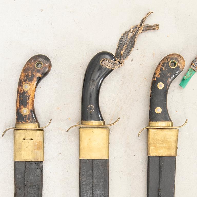 Three Swedish cutlasses 1848 pattern, with scabbards.