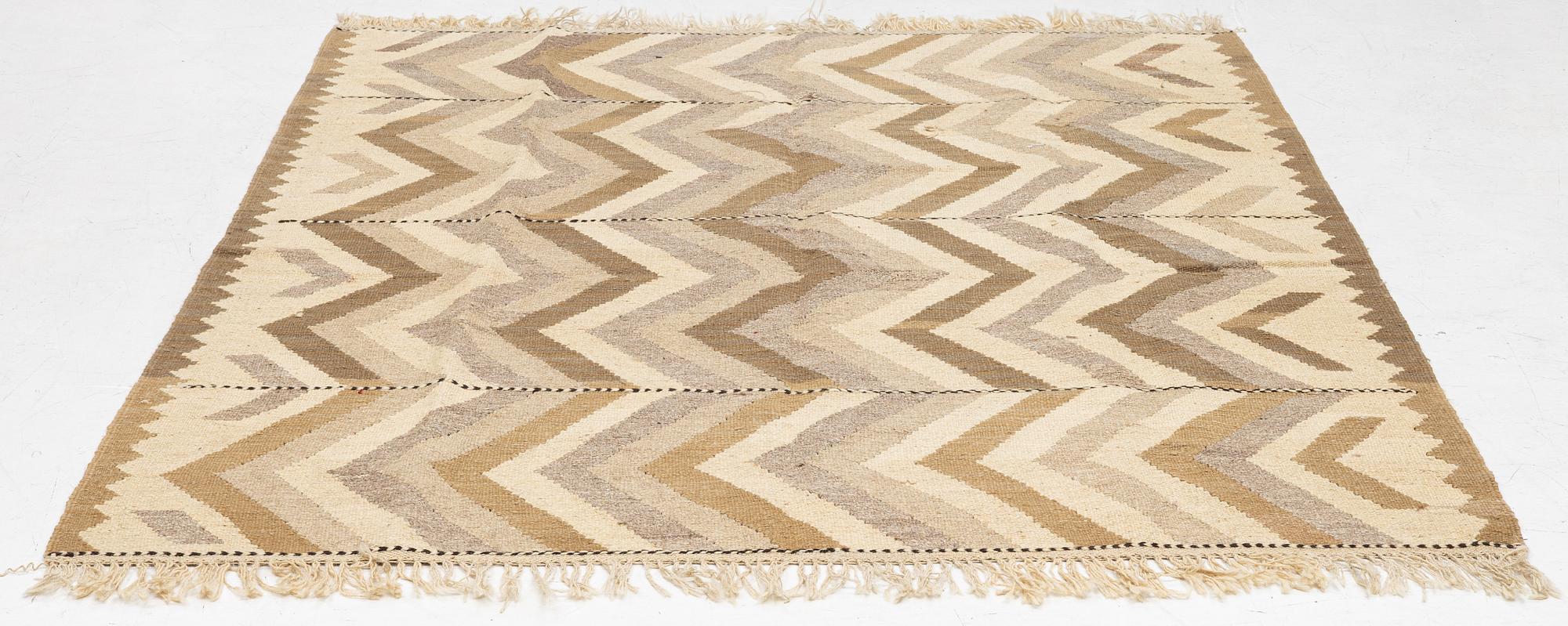 A Kelim rug, c. 229 x 187 cm.