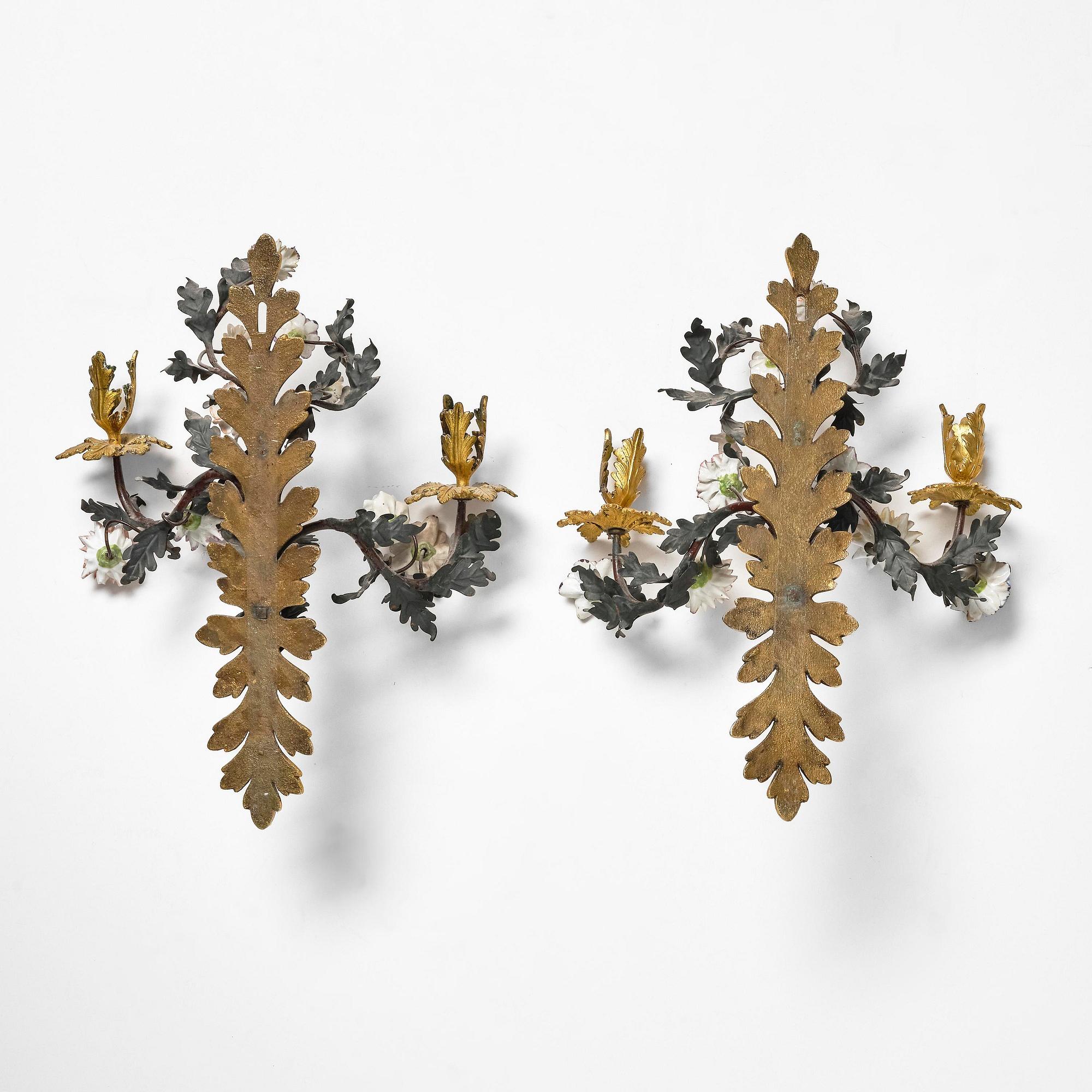 A pair of French Louis XV-style gilt bronze and porcelain two-branch appliques, 19th century.
