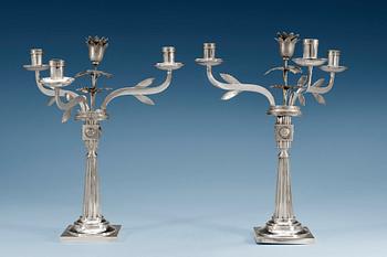 492. A pair of 18th/19th century silver candelabras, partly Häberlein, Nürnberg 1799-1803, the arms by Carl Friedrich Schönberg, after 1820.