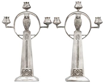 752. A pair of WMF Art Nouveau silver plated metal candelabra.