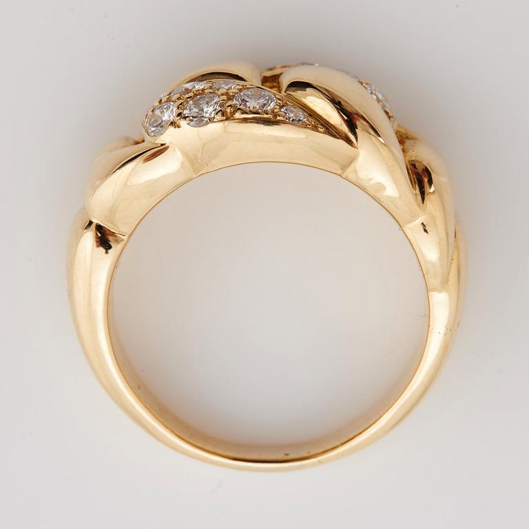 A brilliant cut diamond ring by Cartier.