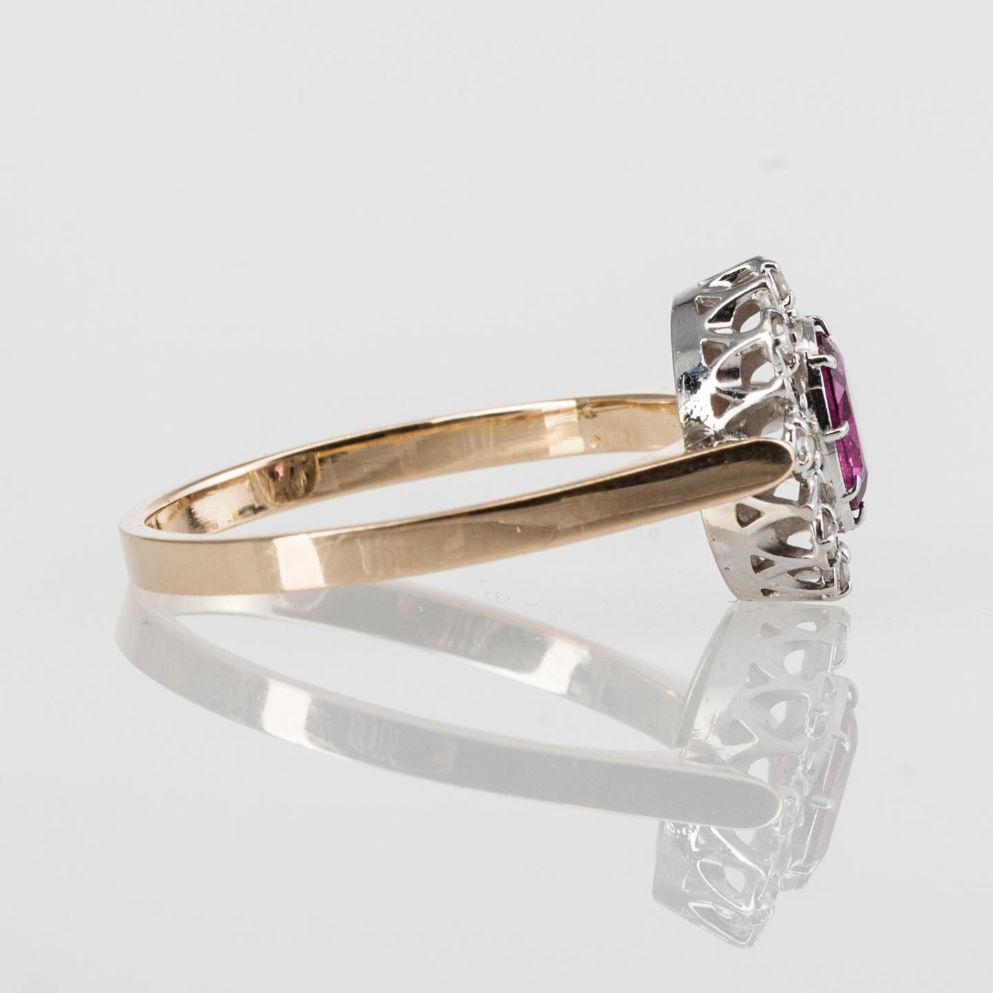 RING, 14K guld, diamanter tot. 0,10 ct och granat, Morris Lindblom, Åbo 1986. Vikt 2,5 g.