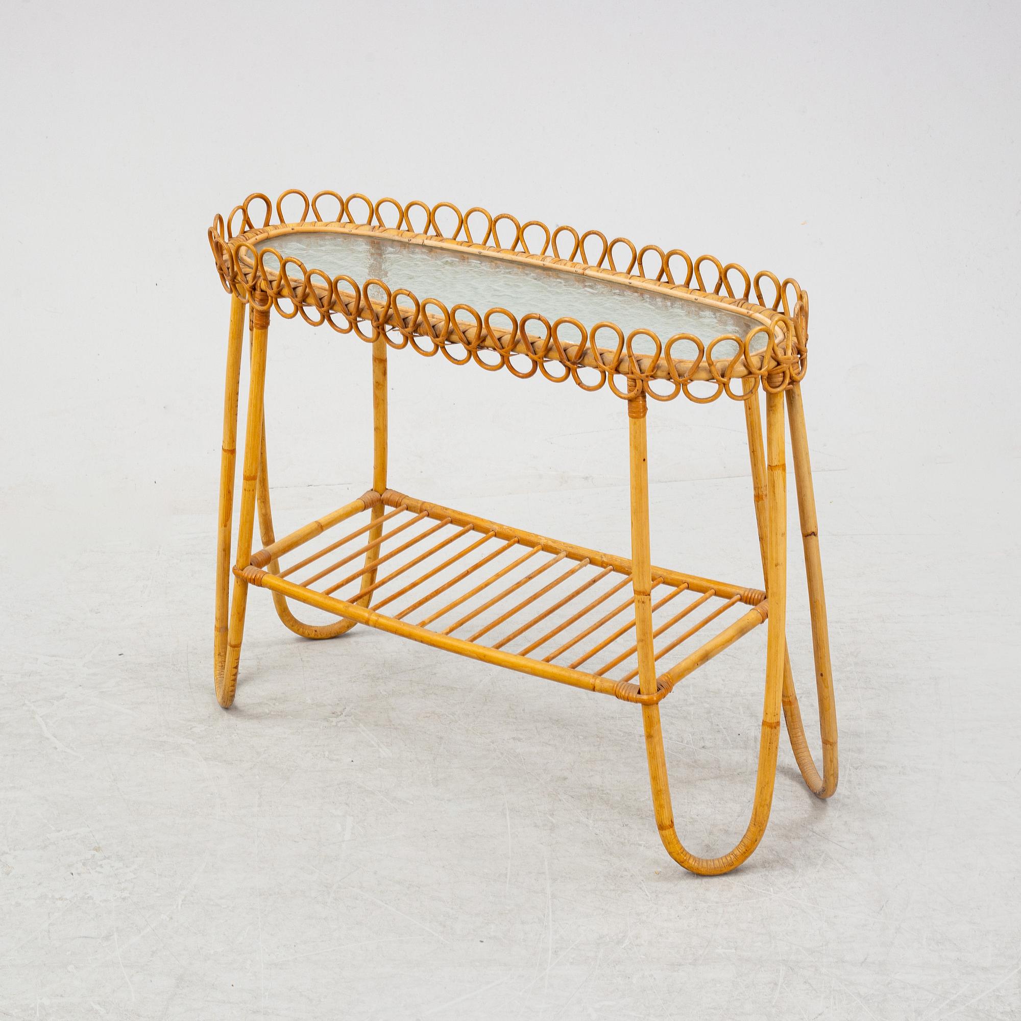 A rattan and glass flower table.