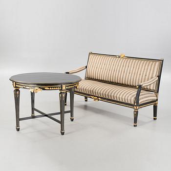 A gustavian style table and sofa, around the year 1900.