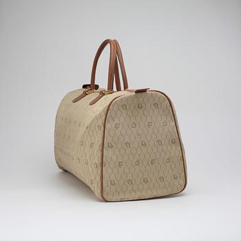 CHRISTIAN DIOR, a beige bag.