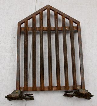 An Anna Petrus brass and iron fire rack, probably by Herman Bergman Sweden 1920's.