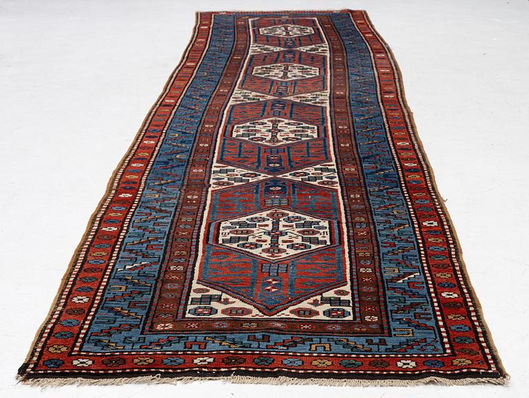 An antique Kurdish runner, probably,. 406 x 105 cm.