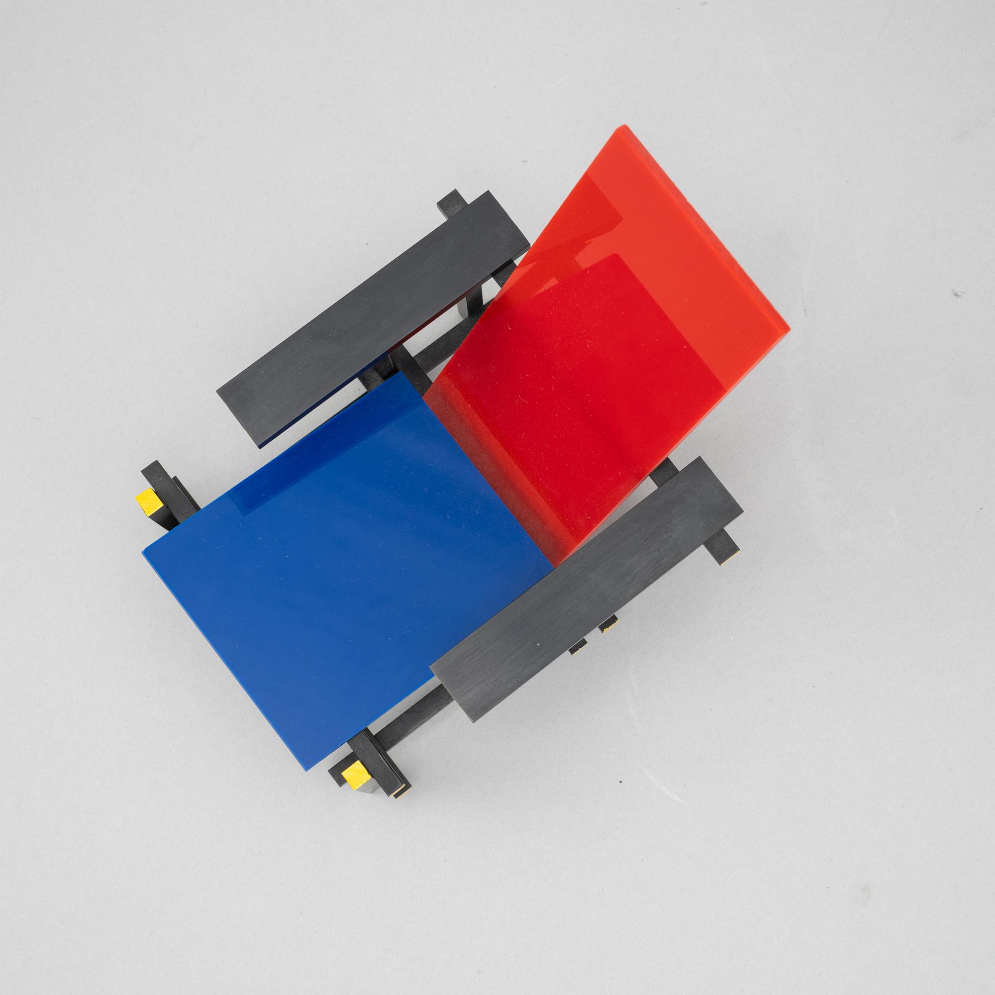 Miniatures of three famous design chairs, 21st century.