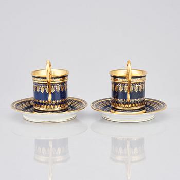 A pair of Sèvres cups with stands, 19th Century.