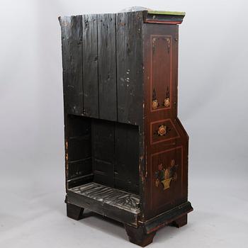 A painted 19th Century folk art bed cabinet.