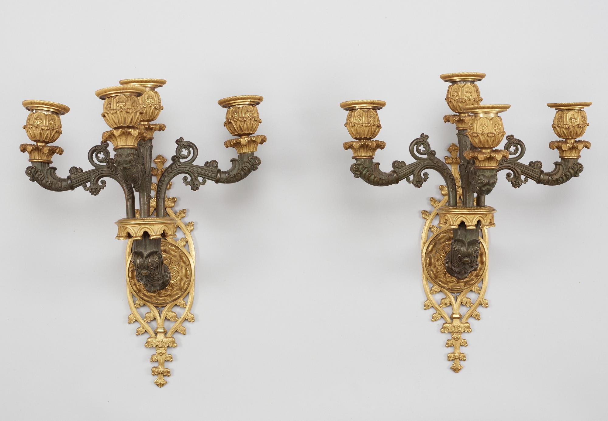 A pair of Neo-Gothic mid 19th Century four-light wall-lights.
