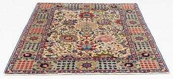 A signed semi-antique Tabriz rug, ca 198 x 142 cm.
