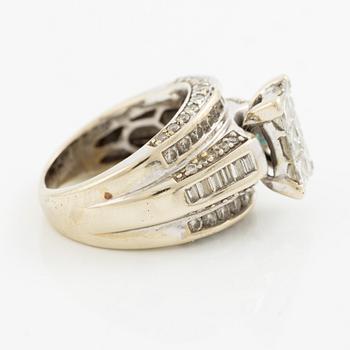 Ring, 14K gold with princess, baguette, and round brilliant-cut diamonds.