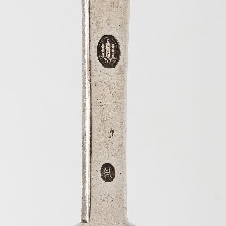 A set of  four silver serving spoons, with a set of 12 coffee spoons, Denmark, early and first half of the 20th century.