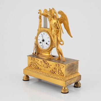 A French Empire ormolu figural mantel clock, early 19th century.