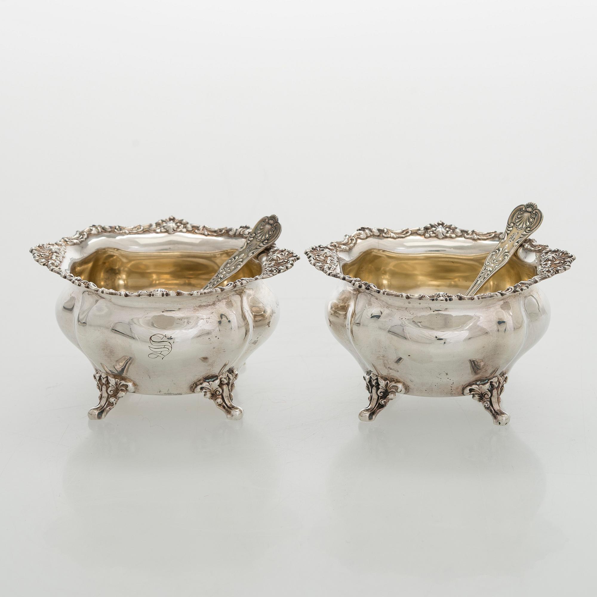 Black Starr & Frost, a pair of sterling silver shakers and sugar bowls, USA around 1900, Gorham pair of sterling spoons.