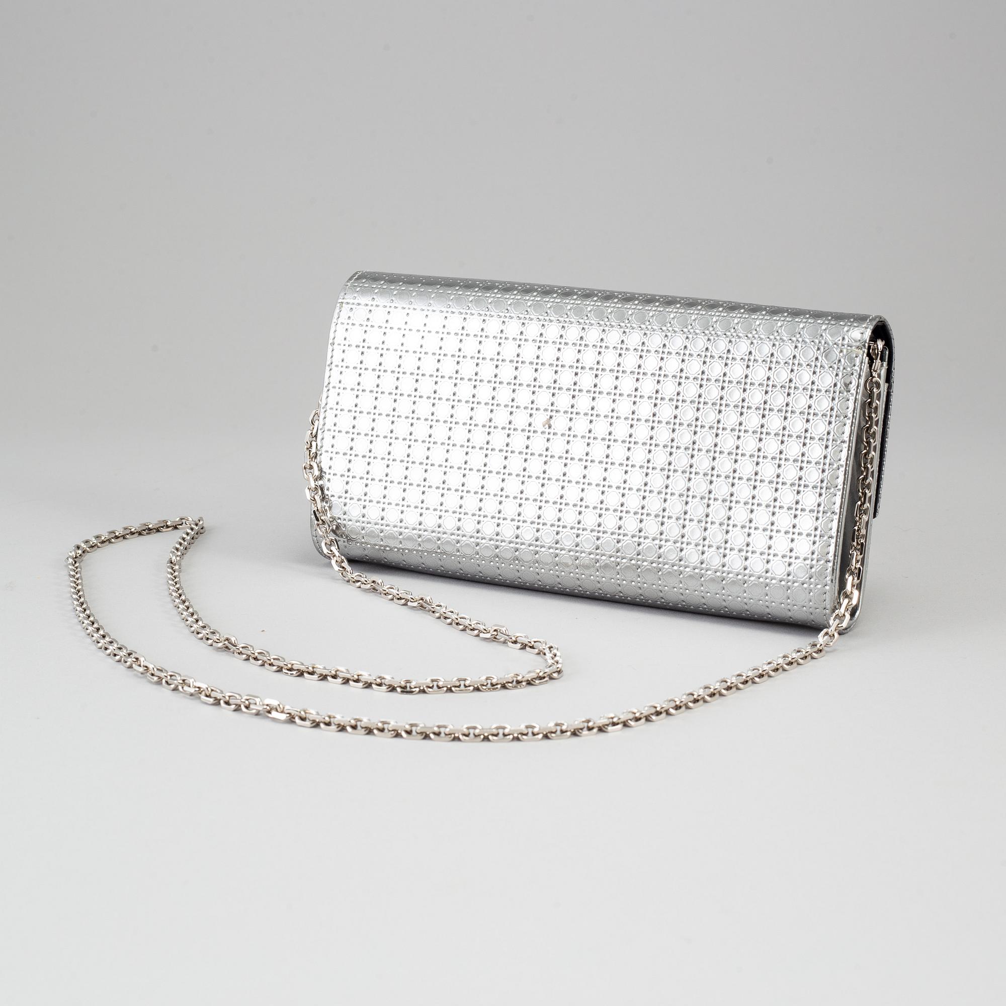 CHRISTIAN DIOR, an embossed metallic leather 'Wallet on Chain' clutch.