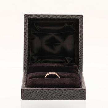 A “Quatre” ring in 18K yellow, pink, white gold and brown PVD by Boucheron.