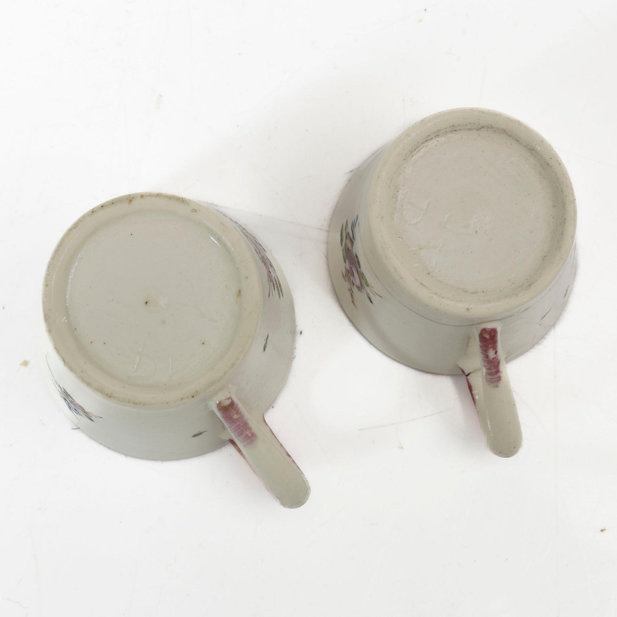 A pair of cups and saucers, France, 18th Century.