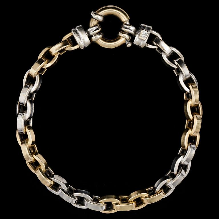 A gold and white gold bracelet, weight 18,8 g.