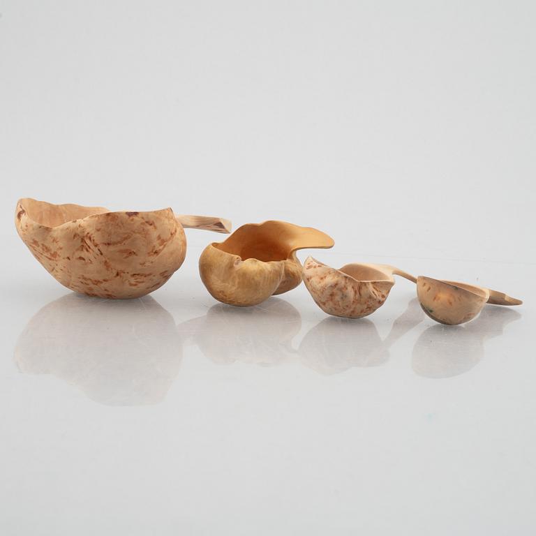 Ten carved burl wood bowls and cups, Sweden, 20th century.