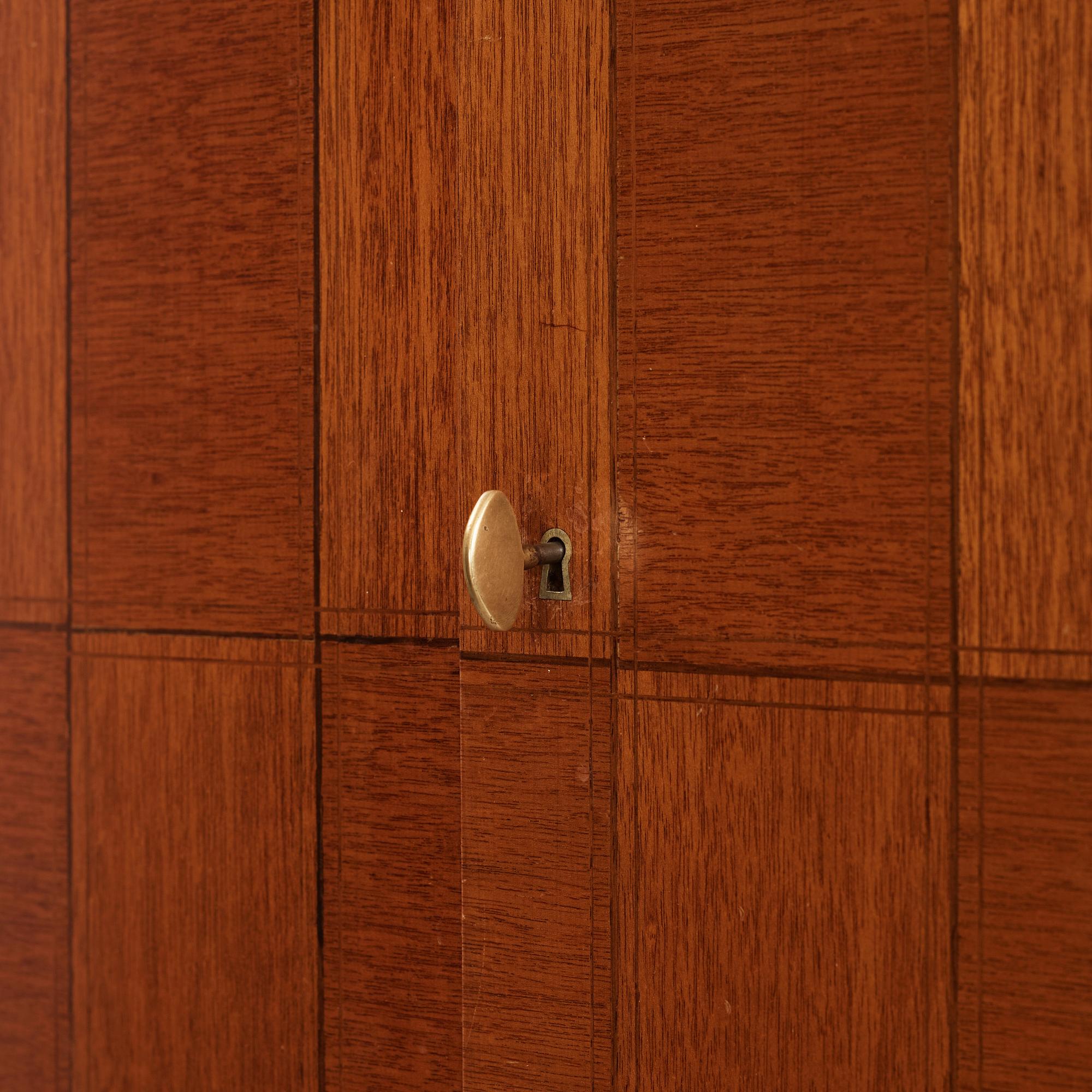 David Rosén, a mahogany and teak cabinet, for Stockholm's Association of Crafts, signed and dated 1959.