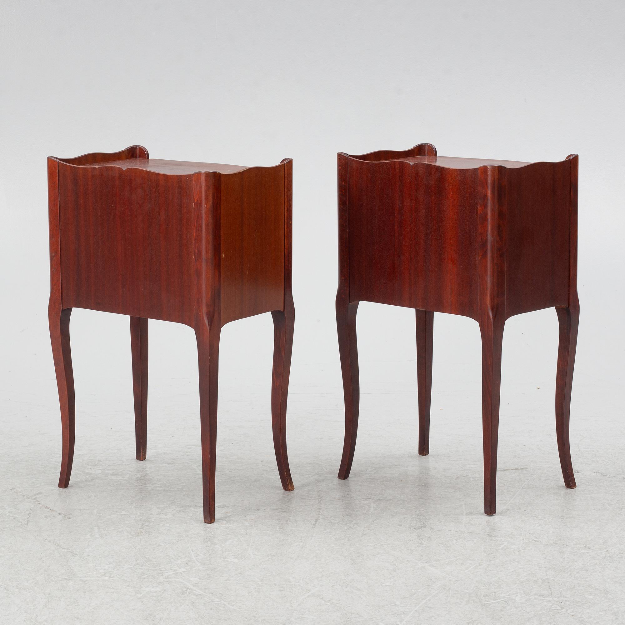 A pair of Rococo style bedside tables, second half of the 20th Century.