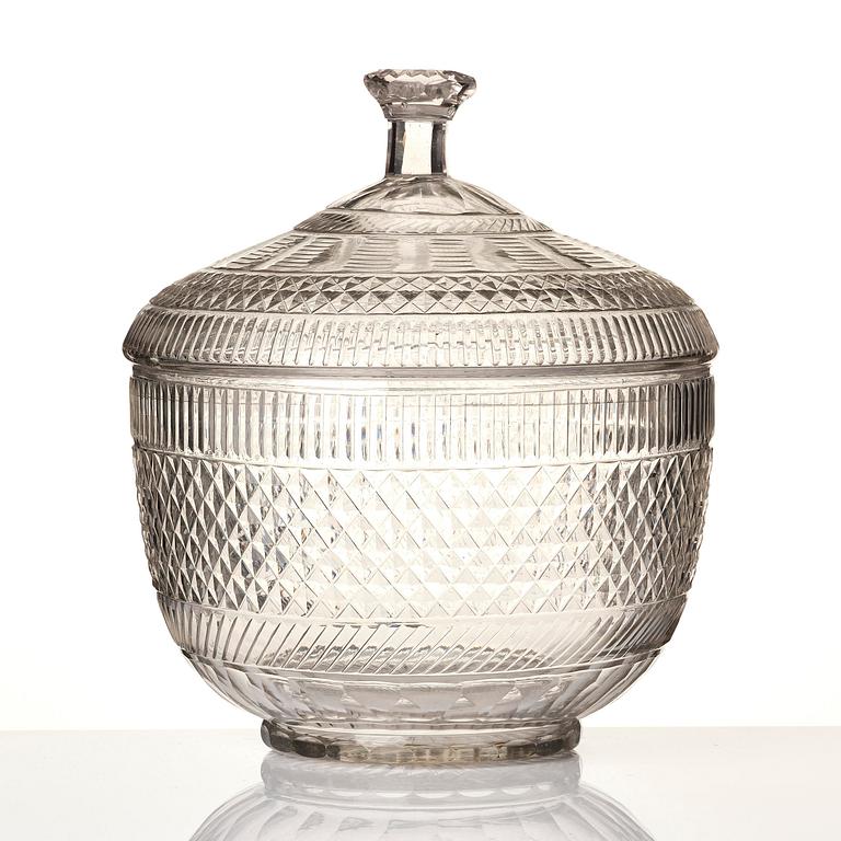 A cut glass punch bowl with cover, stand and ladle, Empire, first part of the 19th century.