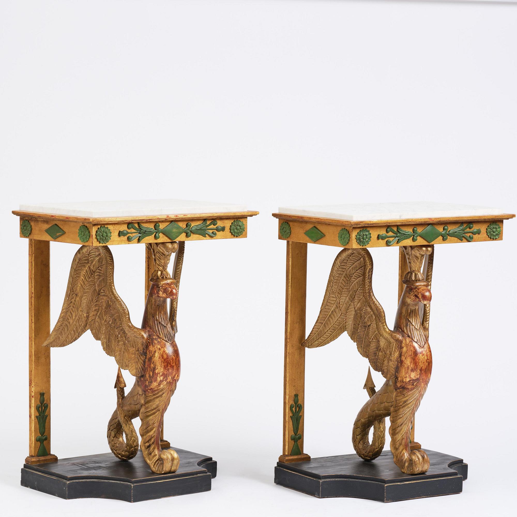 A pair of giltwood console tables, Empire-style incorporating older elements.