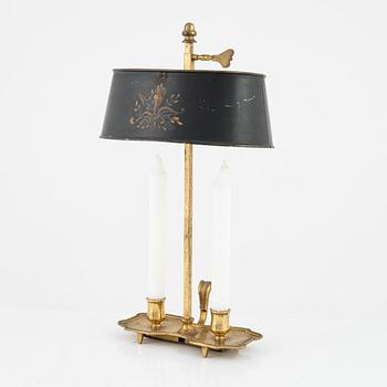 A gilt brass candlestick, 20th Century with older parts.