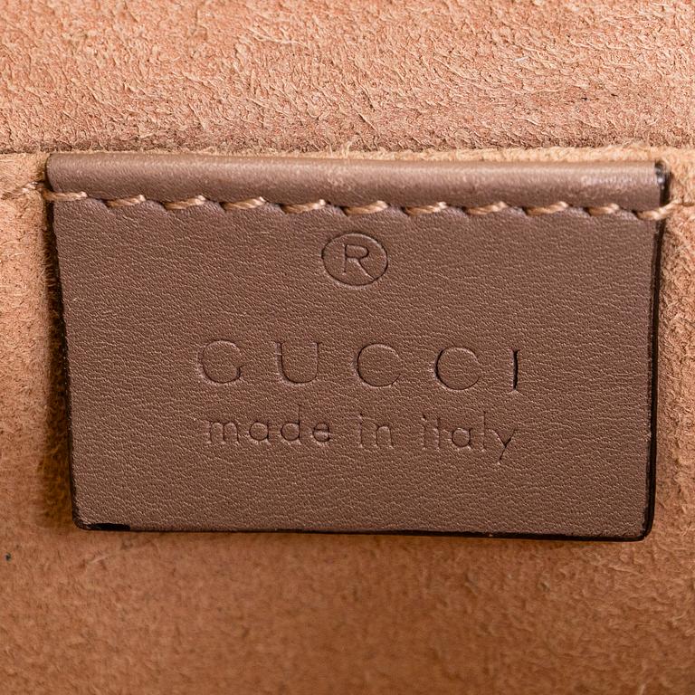 Gucci, a shoulder bag.