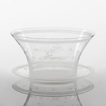 Edward Hald, a 'Flygande Mattan' engraved glass bowl with stand from Orrefors, Sweden 1928.