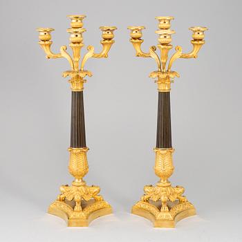 A pair of late empire ormolu candelabra, first half of the 19th century.