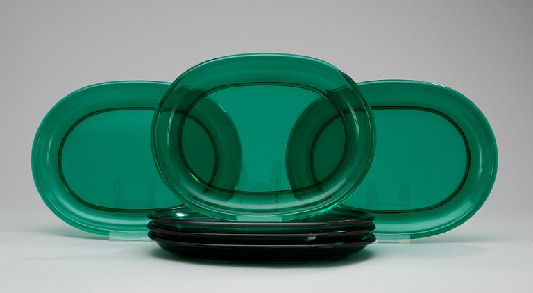 A set of six Josef Frank green glass dinner plates.
