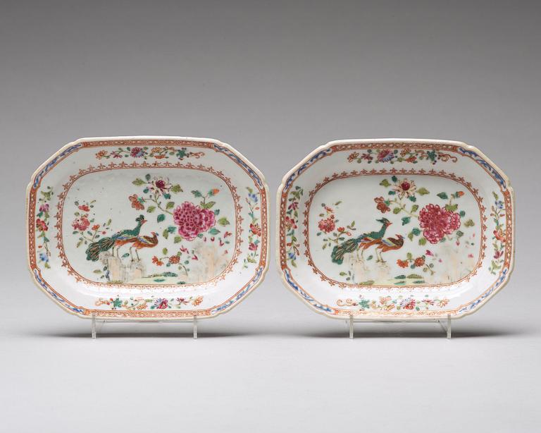 A pair of famille rose 'double peacock' butter tureens with covers and stands, Qing dynasty, Qianlong (1736-95).