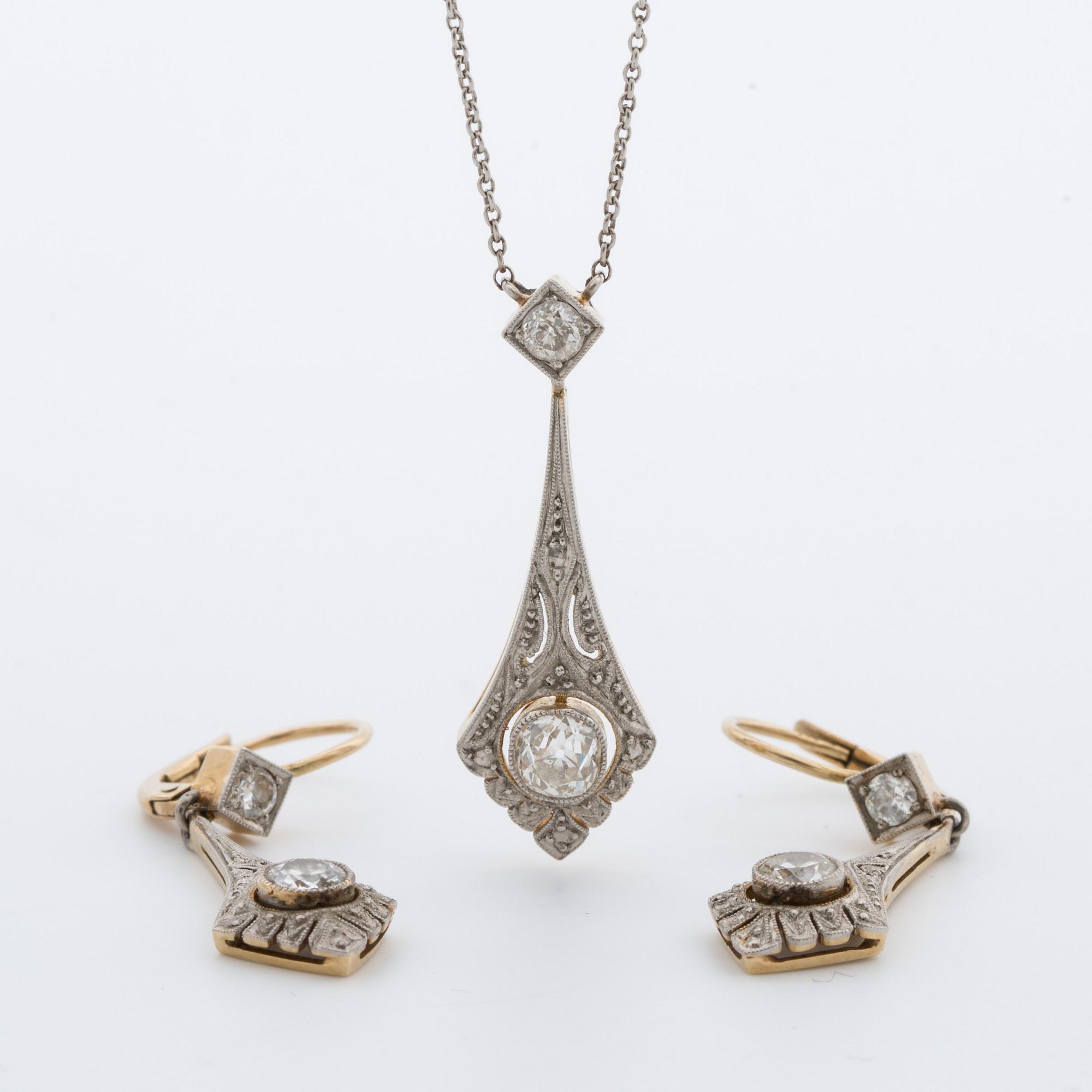 A pendant with a pair off earrings with old-cut diamonds ca 1.10 cts. 1920.