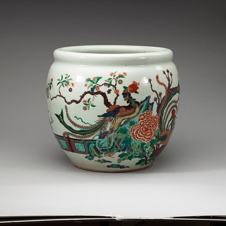 A famille rose jardiniere, decorated with a terrace scene with blossom and birds, late Qing dynasty, about 1900.