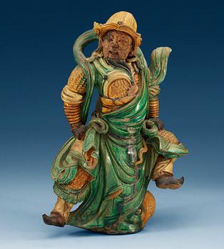 A glazed Ming dynasty rooftile figure of a guardsman, Ming dynasty (1368-1644).