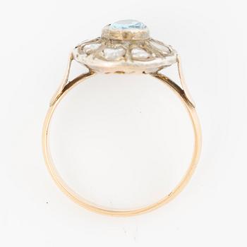 Ring in 14K gold with a faceted topaz and rose-cut diamonds.