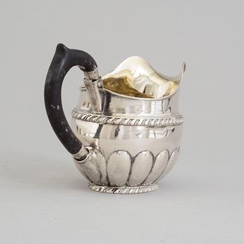 A RUSSIAN SILVER CREAM JUG, maker's mark Erik Frisk, St petersburg, 1825.