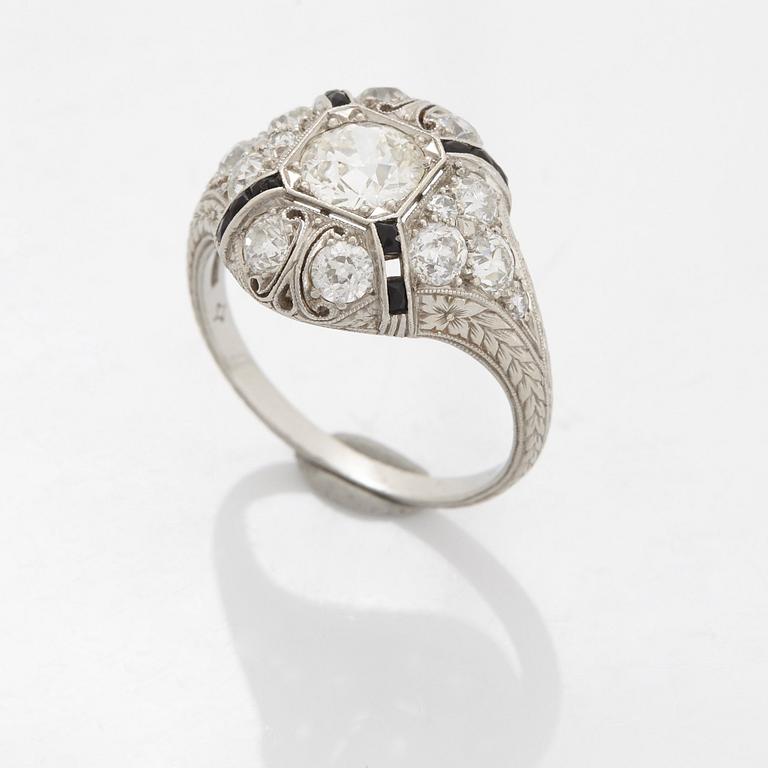 A platinum ring set with an old-cut diamond.