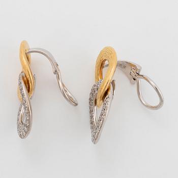 A pair of 18K gold and white gold Meister earrings set with round brilliant-cut diamonds.